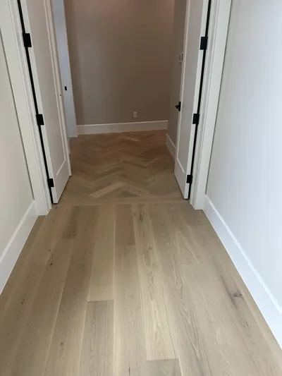 White oak stair landing with herringbone pattern
